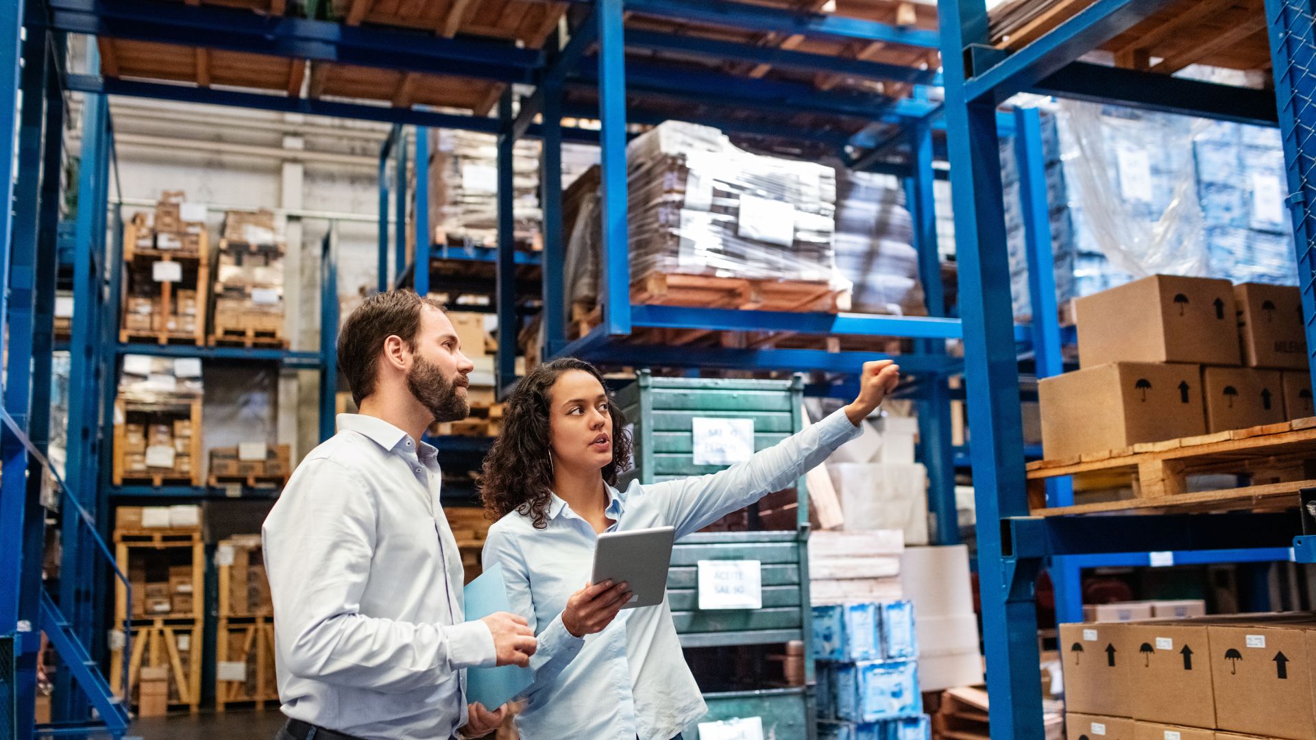 Two people checking inventory in a warehouse