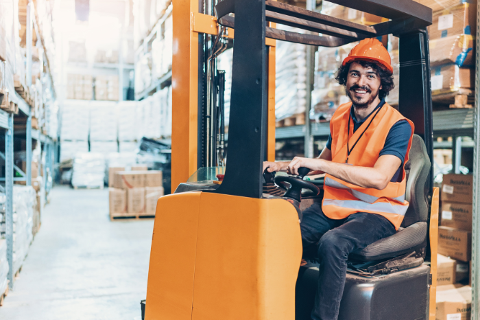forklift driver smiling while driving