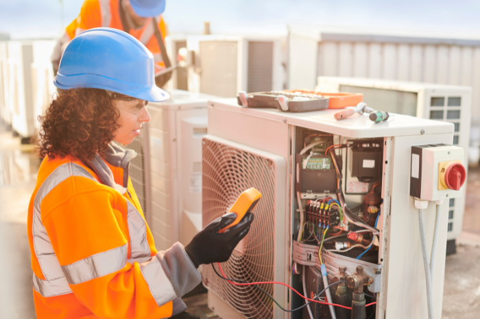 Maintenance technician in uniform working on a repair