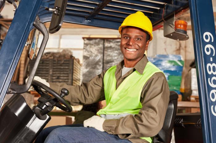 warehouse worker with hard hat and safety gear