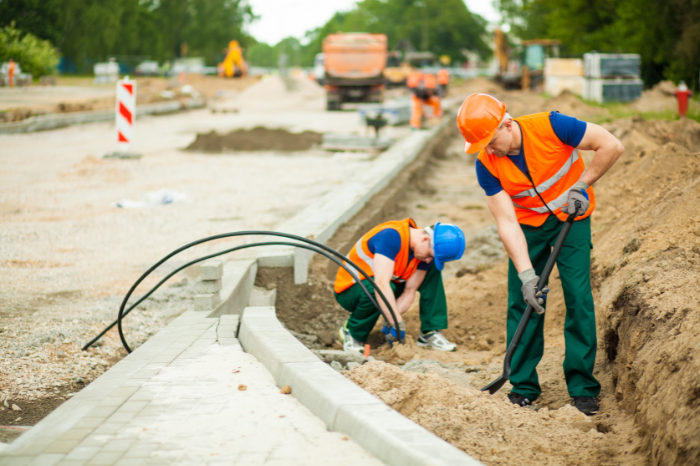 highway workers digging next to the road