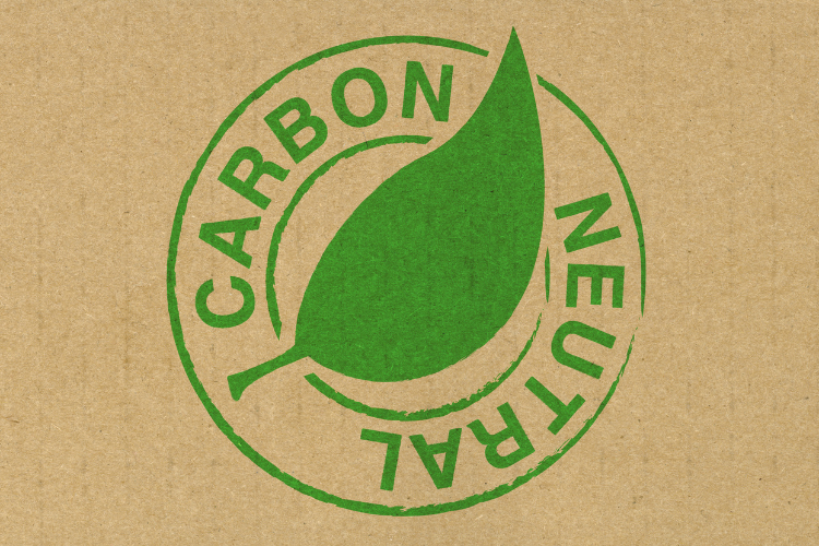 Carbon Neutral logo in green on a tan background