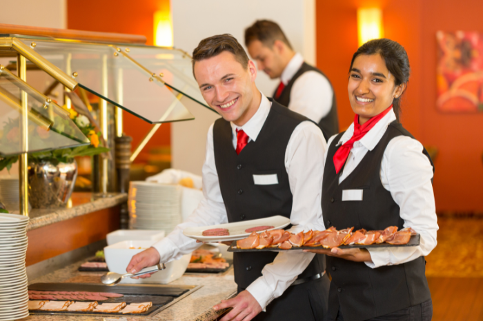 Banquet servers in uniform posing