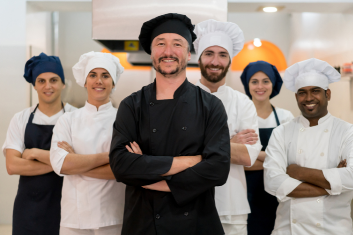 chefs and line cooks in uniform