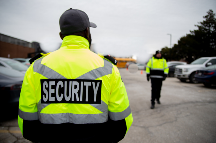 Parking lot security guards monitoring cars