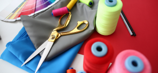 thread and fabric on a table for discussion on uniform customization