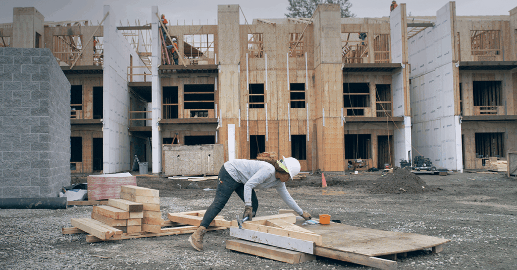 Female utility worker wearing uniform on construction job site
