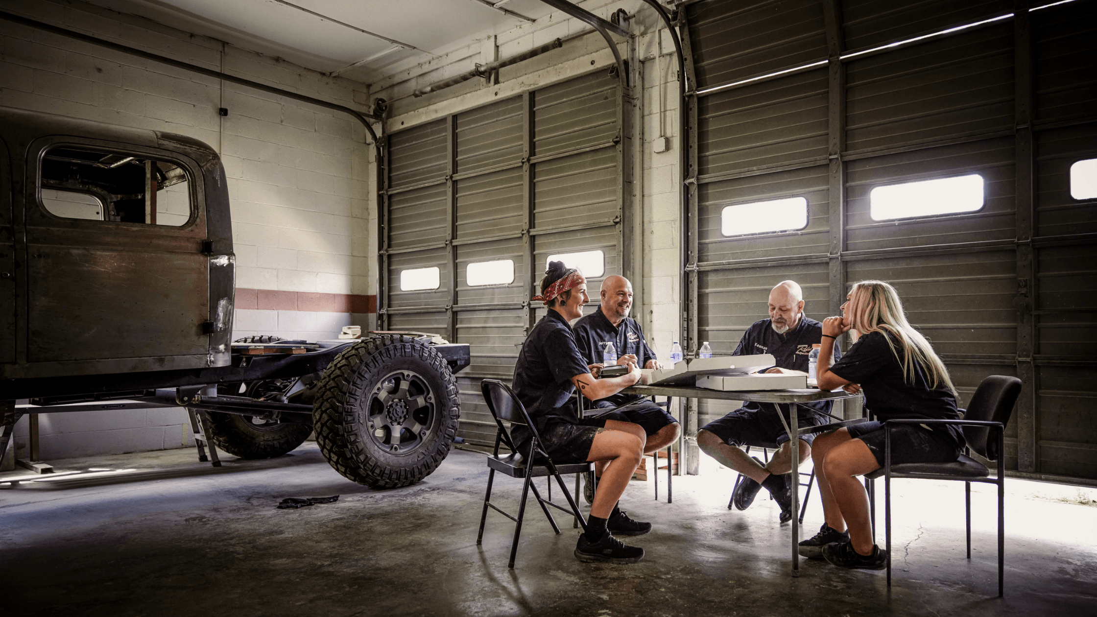 Outdoor utility worker wearing a breathable, moisture-wicking cooling uniform and high-visibility vest during a hot summer shift.