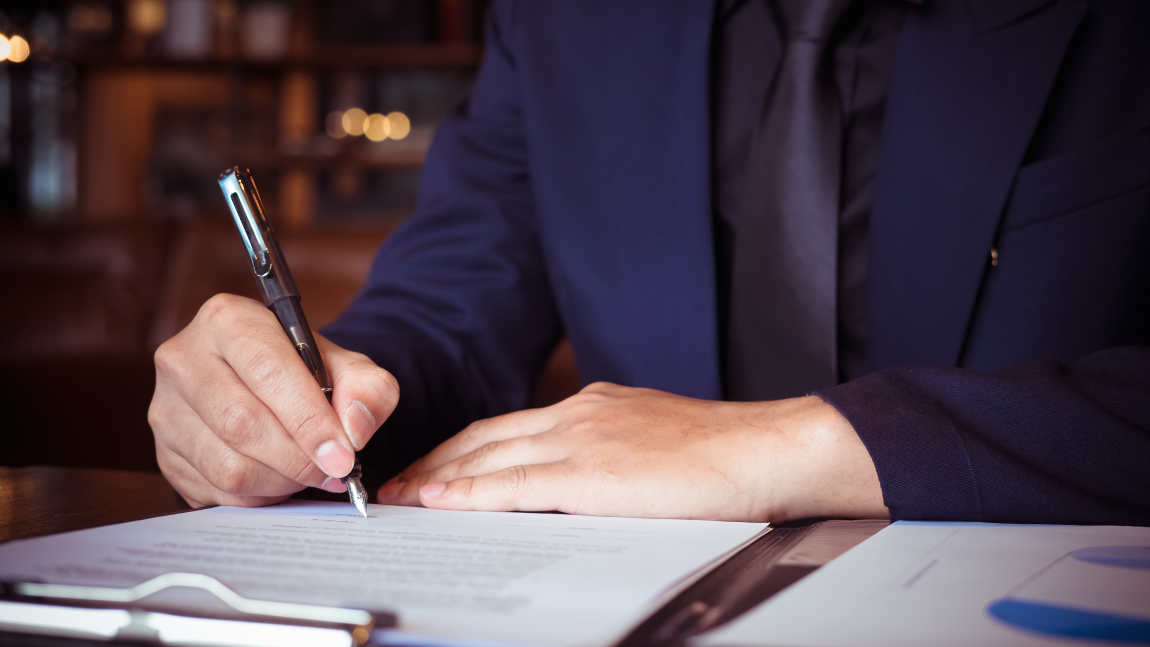 Procurement manager reviewing a uniform program contract before signing